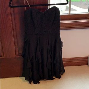 Strapless black formal dress.